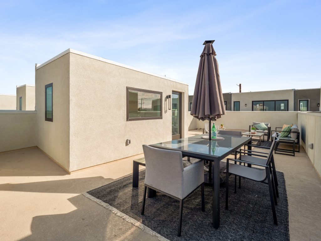 San Pedro new home features spacious roof deck.