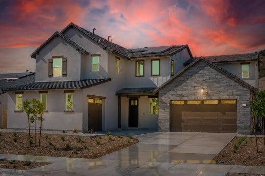Exterior elevation of Lot 46, Orchard Plan 11, Williams Ranch community, Los Angeles, California, captured at dusk